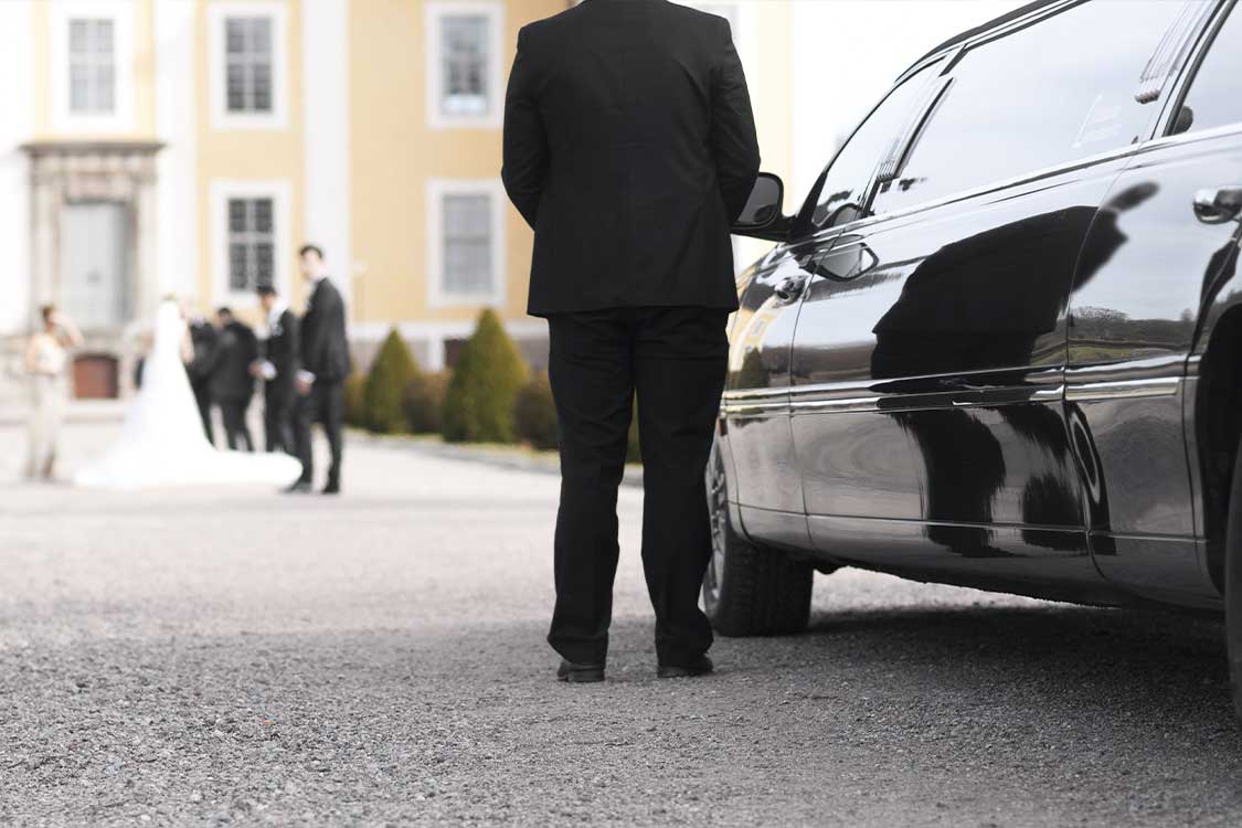 man standing side of the car